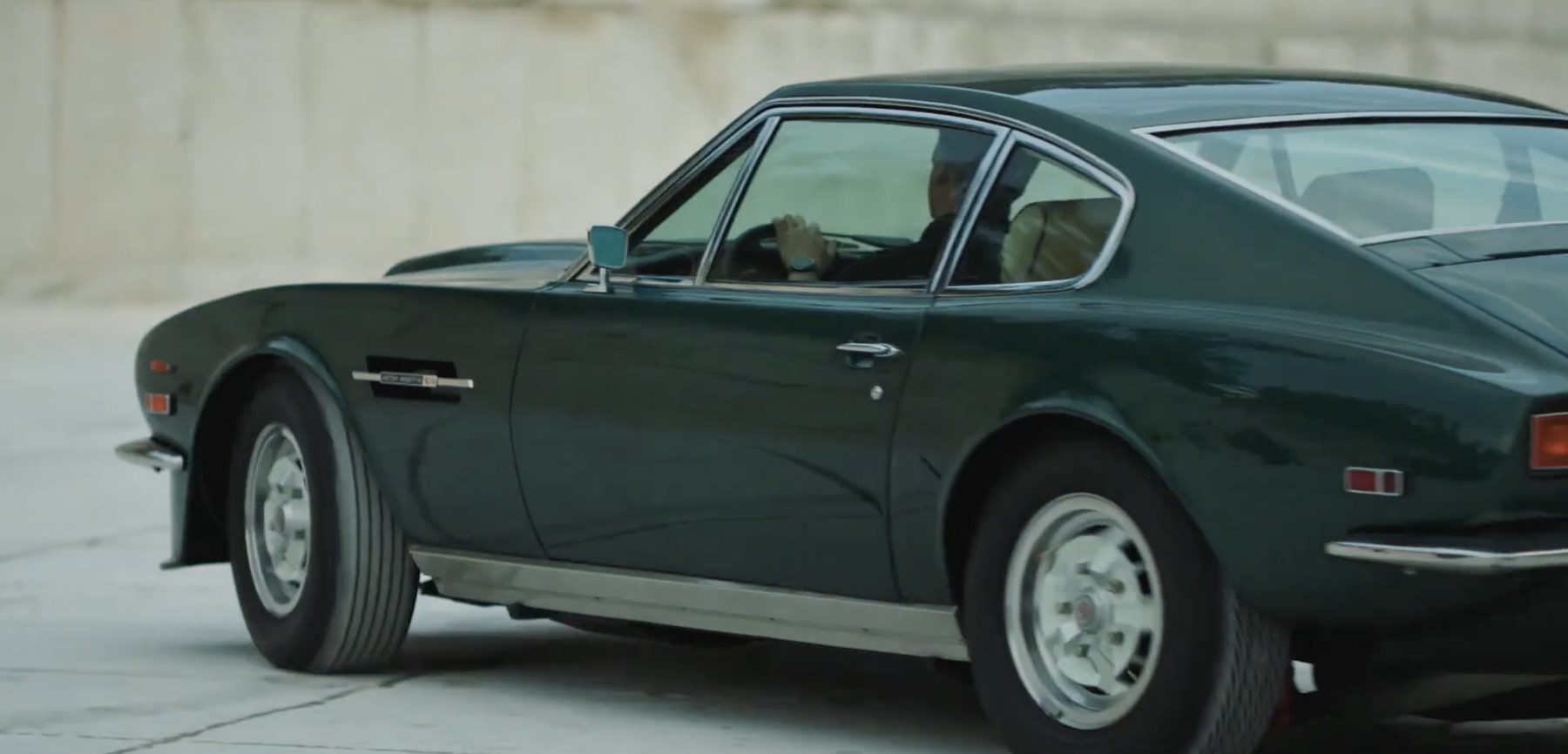 Aston Martin and Girard-Perregaux brand film, vintage car on a mountain road