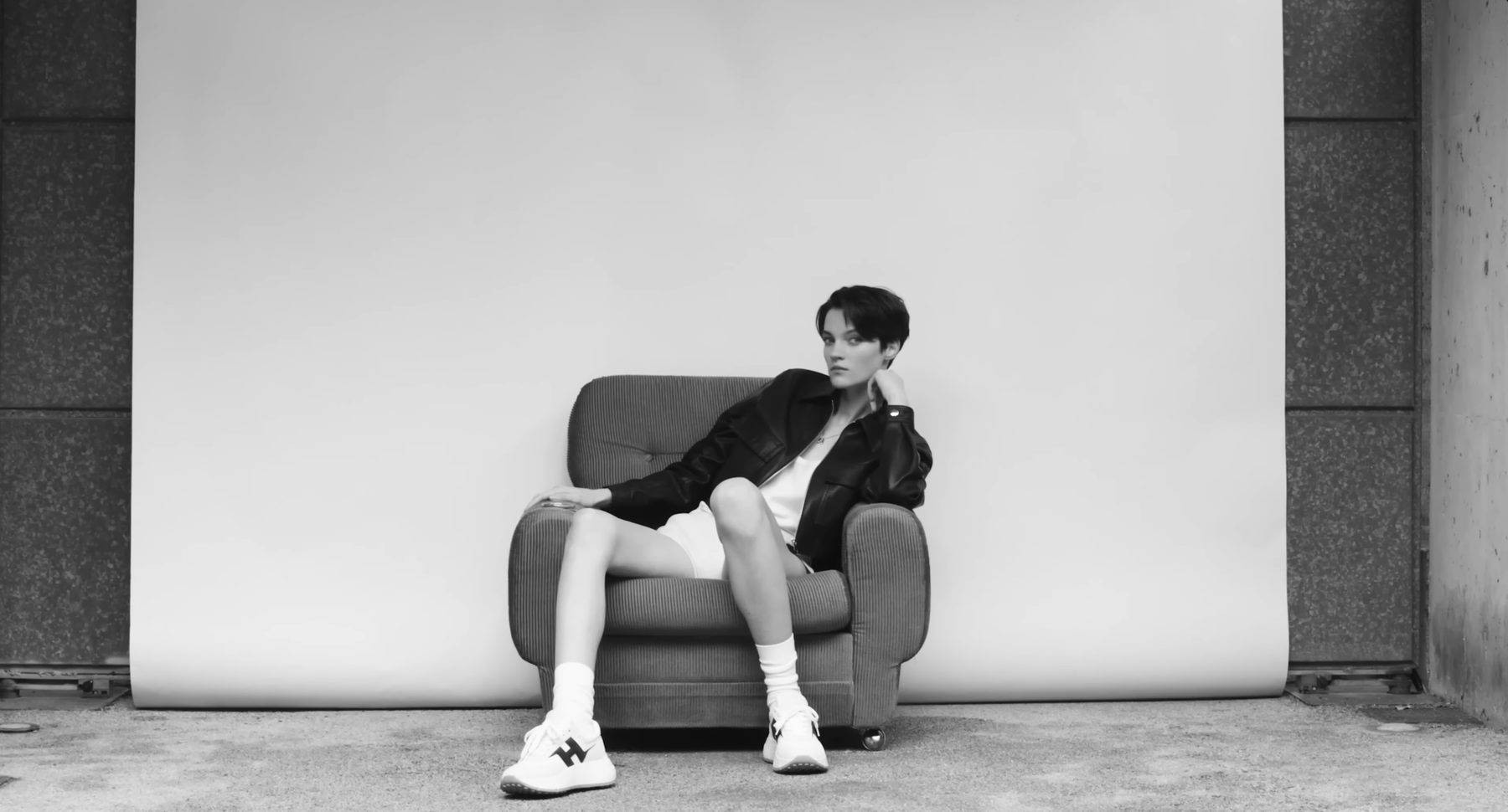 Hogan campaign film, a single armchair against a white backdrop — image 02