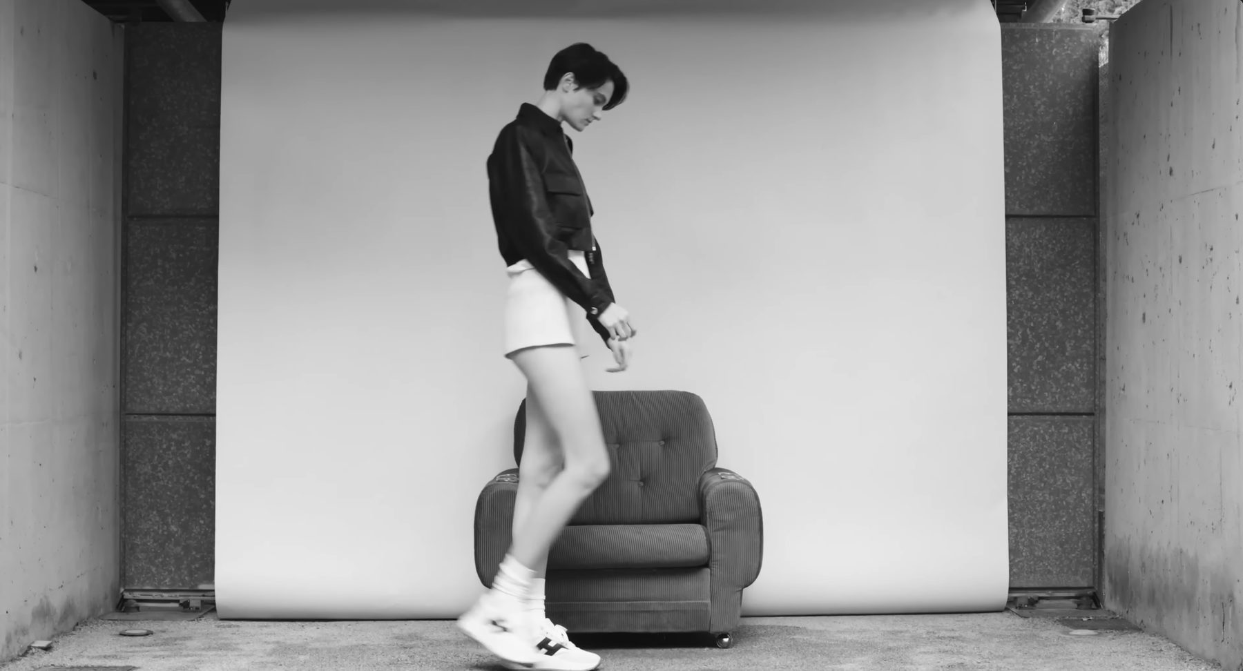 Hogan campaign film, a single armchair against a white backdrop — image 03