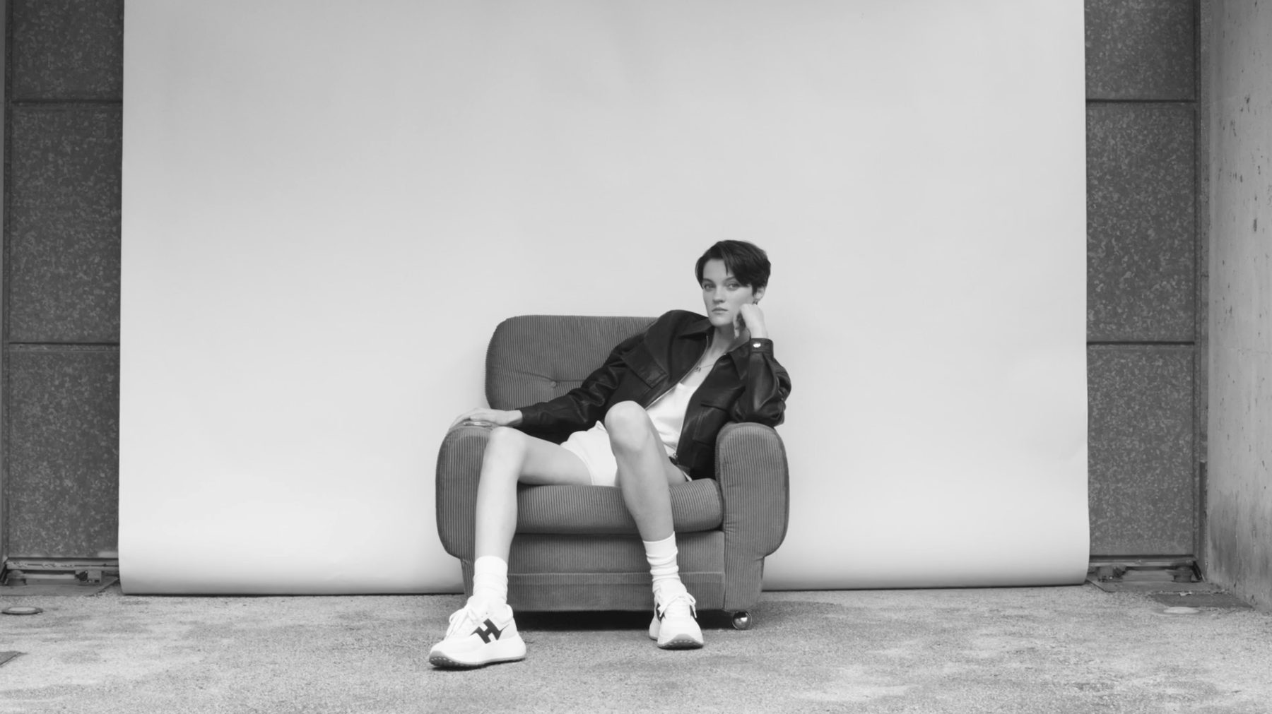 Hogan campaign film, a single armchair against a white backdrop — image 04